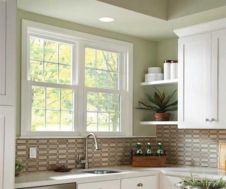 Bright kitchen with window and shelves.