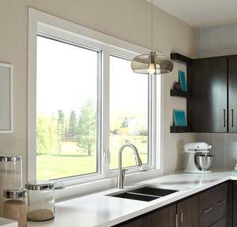 Modern kitchen with large window and shelves.